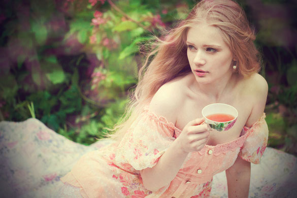 beautiful-woman-with-flowering-tree-drinking-tea