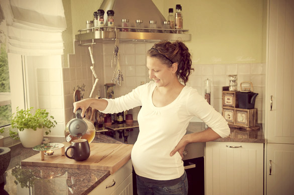 pregnant-woman-preparing-tea-at-home
