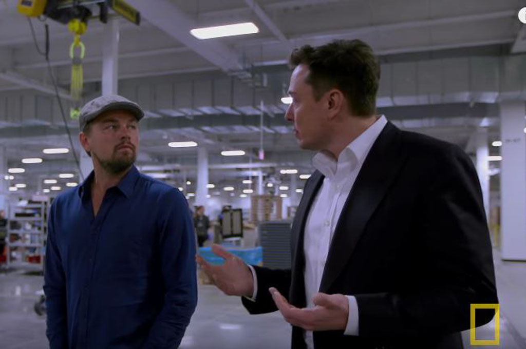 Elon-Musk-and-Leonardo-DiCaprio-in-Tesla-Gigafactory-Screen-Shot.jpg